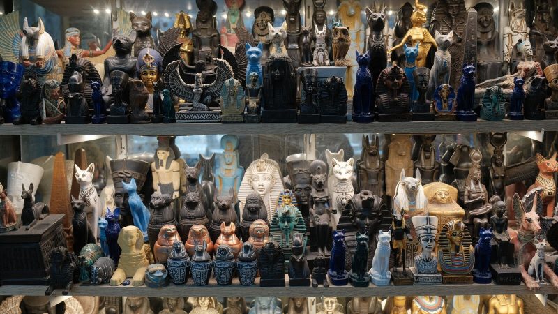 Vibrant display of Egyptian statues and artifacts showcasing pharaohs, gods, and ancient artifacts.
