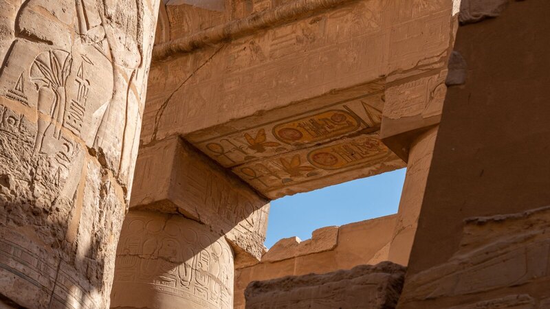 Detailed view of ancient hieroglyphics at Karnak Temple, Egypt, showcasing historical and architectural significance.