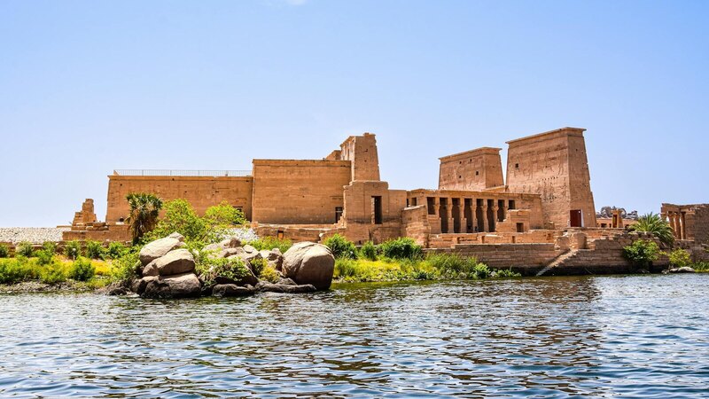 Scenic view of Philae Temple on the Nile River, showcasing ancient Egyptian architecture.