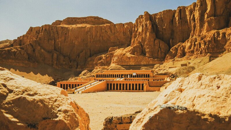 Explore the majestic Hatshepsut Temple nestled in the rocky desert landscape of Luxor, Egypt.