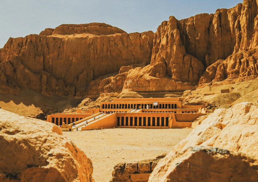Explore the majestic Hatshepsut Temple nestled in the rocky desert landscape of Luxor, Egypt.