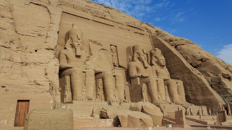 Majestic view of the Abu Simbel Temples carved into rock in Egypt, showcasing ancient Egyptian architecture.