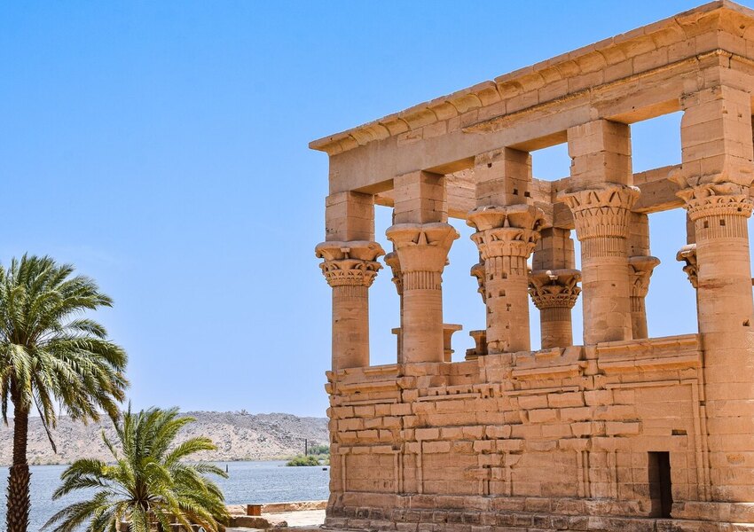 Explore the majestic ruins of an ancient temple by the Nile in Aswan, Egypt.