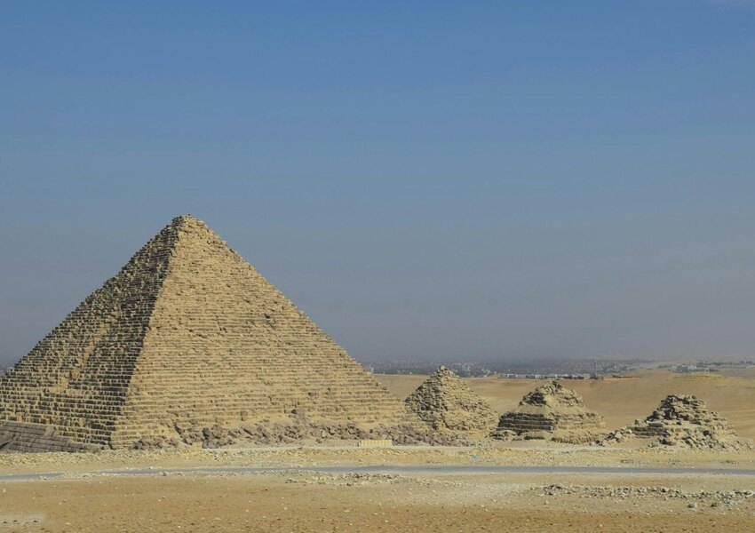 A stunning view of the Pyramids of Giza in Cairo, Egypt on a sunny day.