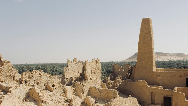 Explore the ancient ruins of an oracle temple amidst Egypt's arid landscape in Matrouh Governorate.