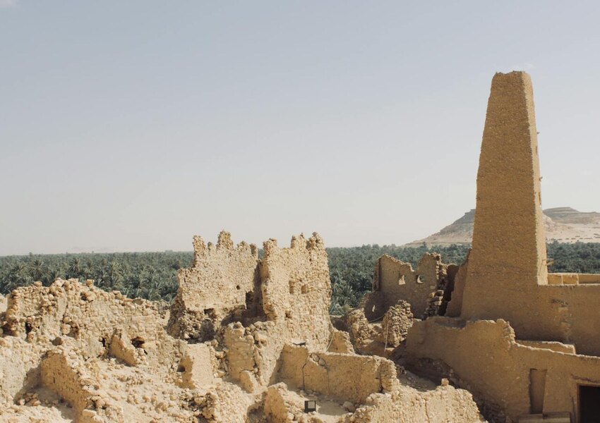 Explore the ancient ruins of an oracle temple amidst Egypt's arid landscape in Matrouh Governorate.