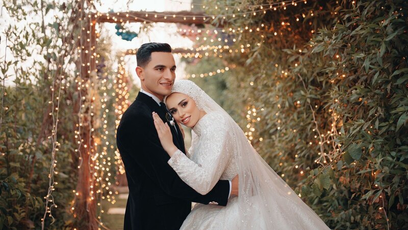 Beautiful couple embracing at an outdoor wedding in Cairo, Egypt.