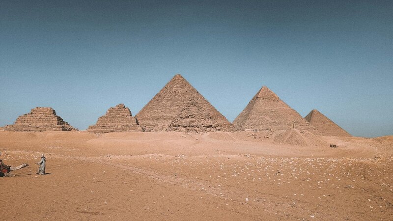 Stunning view of the Great Pyramids of Giza in Egypt under a clear sky.