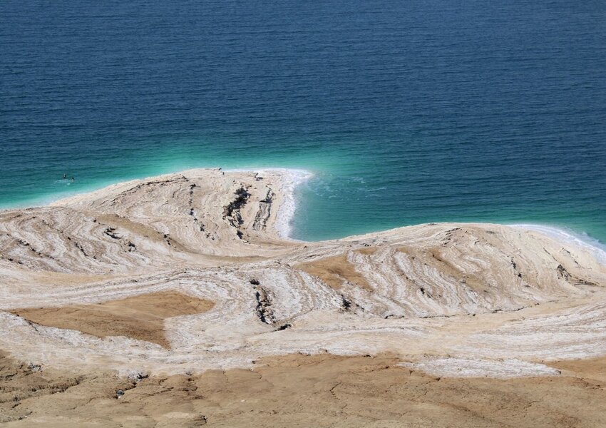 A striking aerial view of the Dead Sea's salt formations and blue waters.