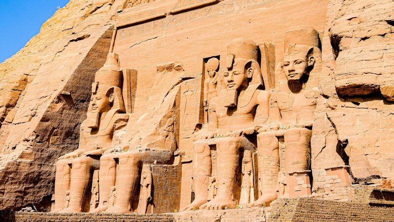 Explore the intricately carved statues of Ramses II at the Abu Simbel temple complex.